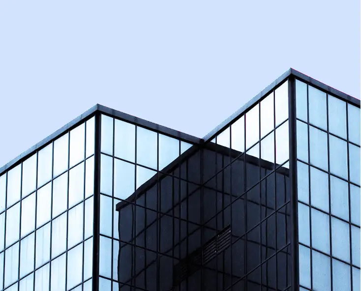 A skyscraper against a blue sky