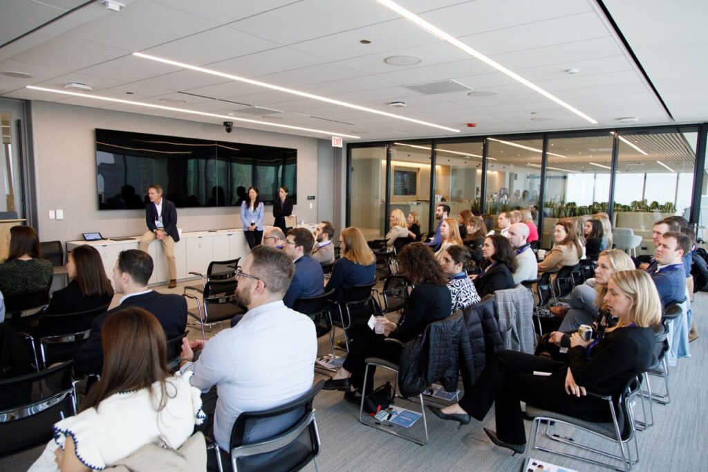 A photo of an Antares employee presenting in front of a group of people.