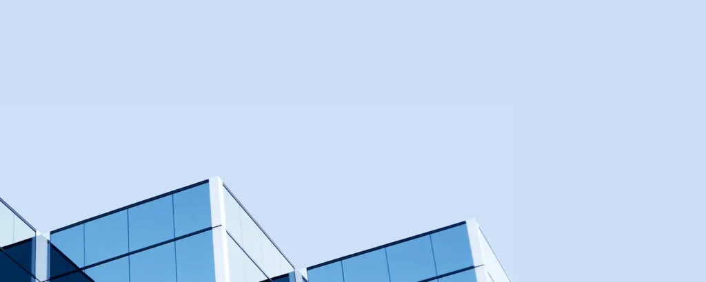 A skyscraper against a blue sky.