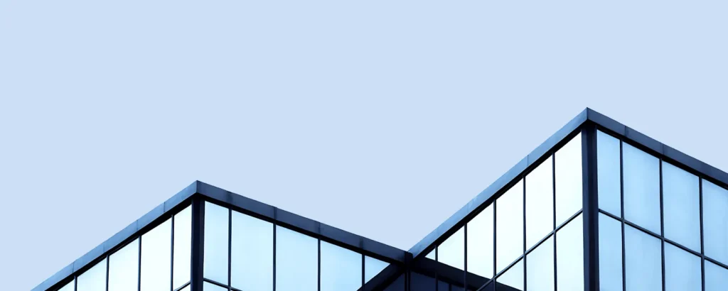 A skyscraper against a blue sky.