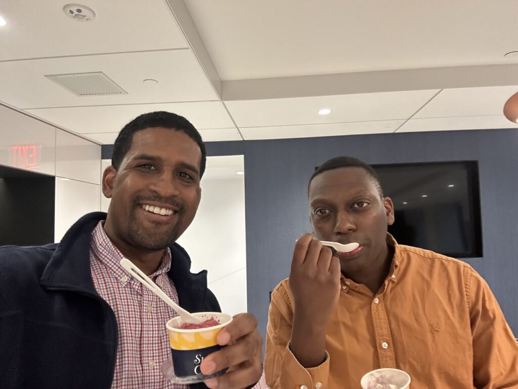 Two Antares employees eating a delicious frozen treat.