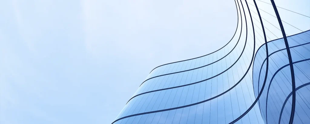 A skyscraper against a blue sky.
